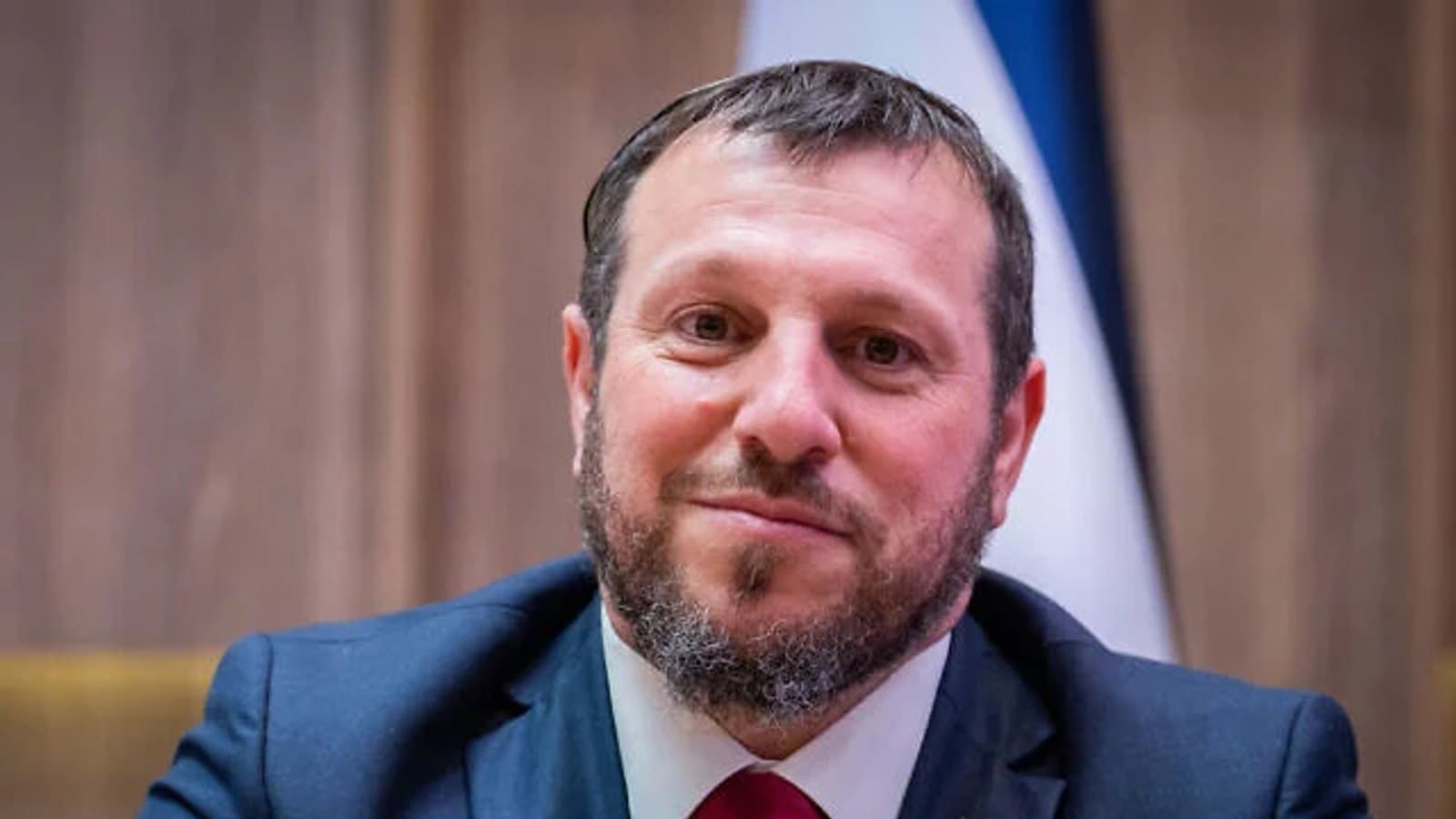 Heritage Minister Amichay Eliyahu seated in front of an Israeli flag. File photograph.