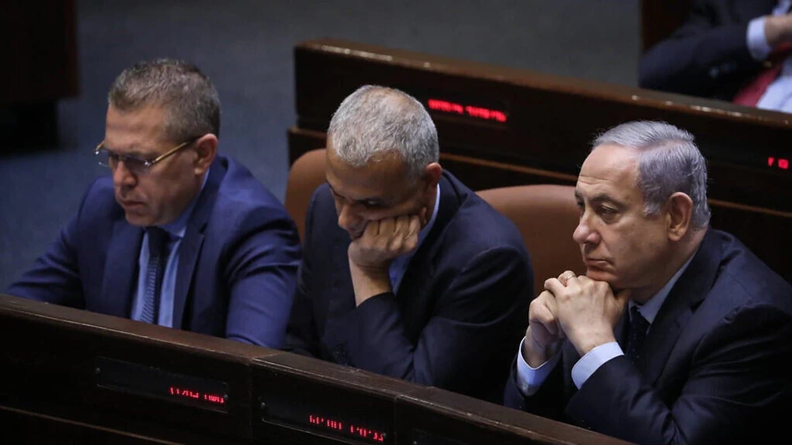 Gideon Sa'ar, Bezalel Smotrich and Benjamin Netanyahu seated together in the Knesset plenum.