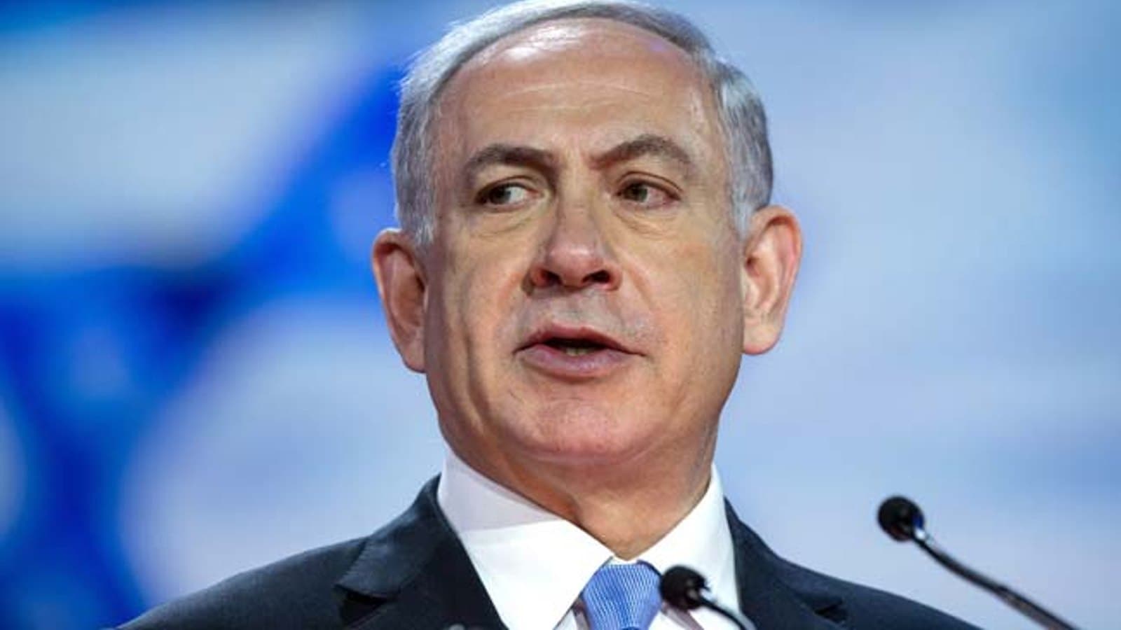 Benjamin Netanyahu speaking at a podium with microphones. File photograph.