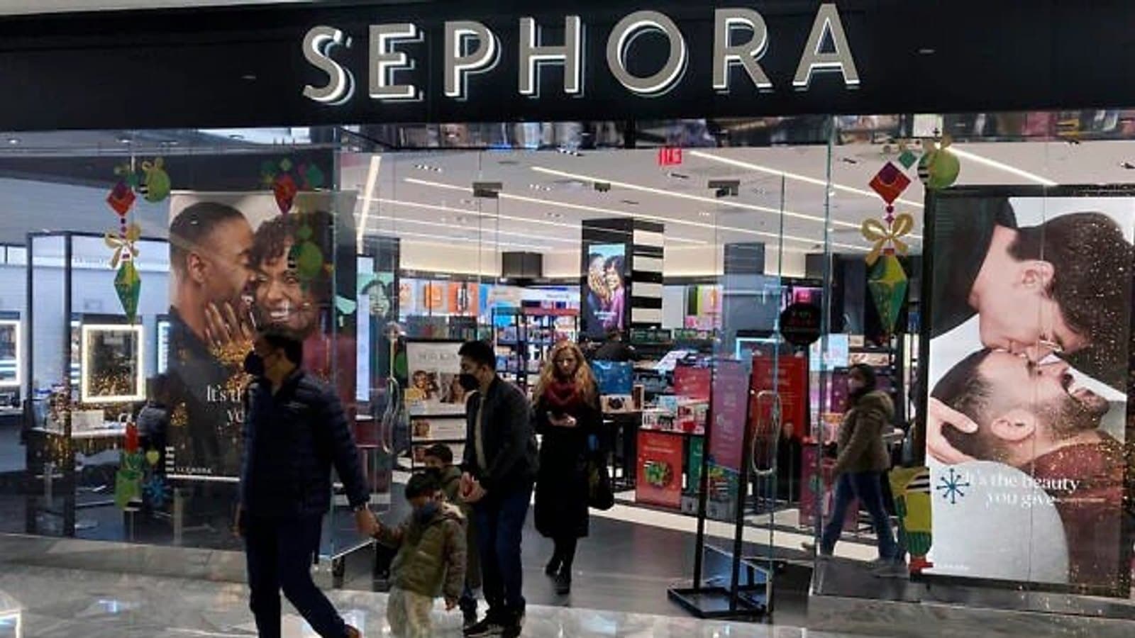 Shoppers passing a Sephora storefront in a shopping centre. File photograph.