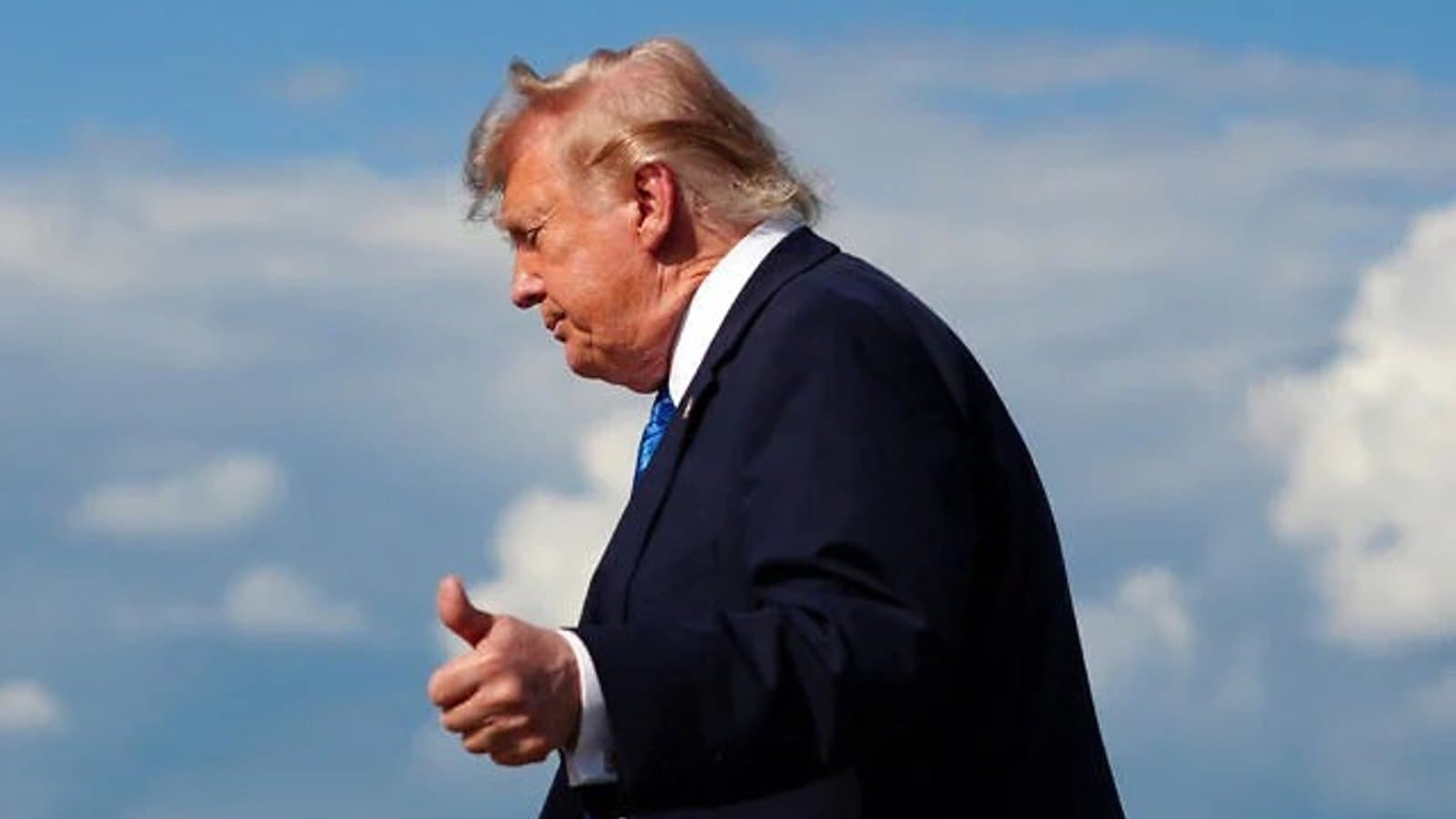 US President Donald Trump gestures as he walks across an airfield. File photograph.