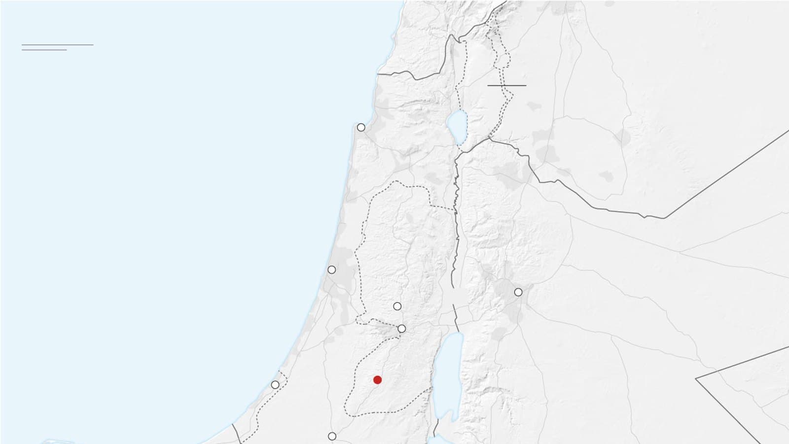 A map of the West Bank marking the location of Hebron with a red dot.